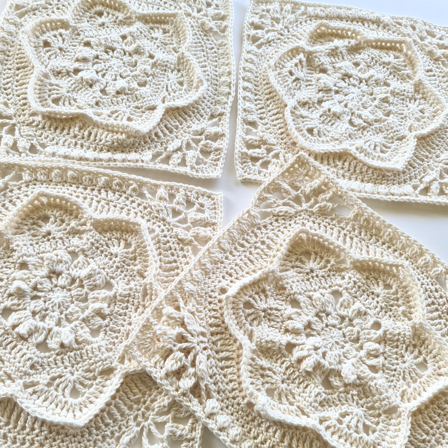 four cream floral Asterales granny squares - not joined