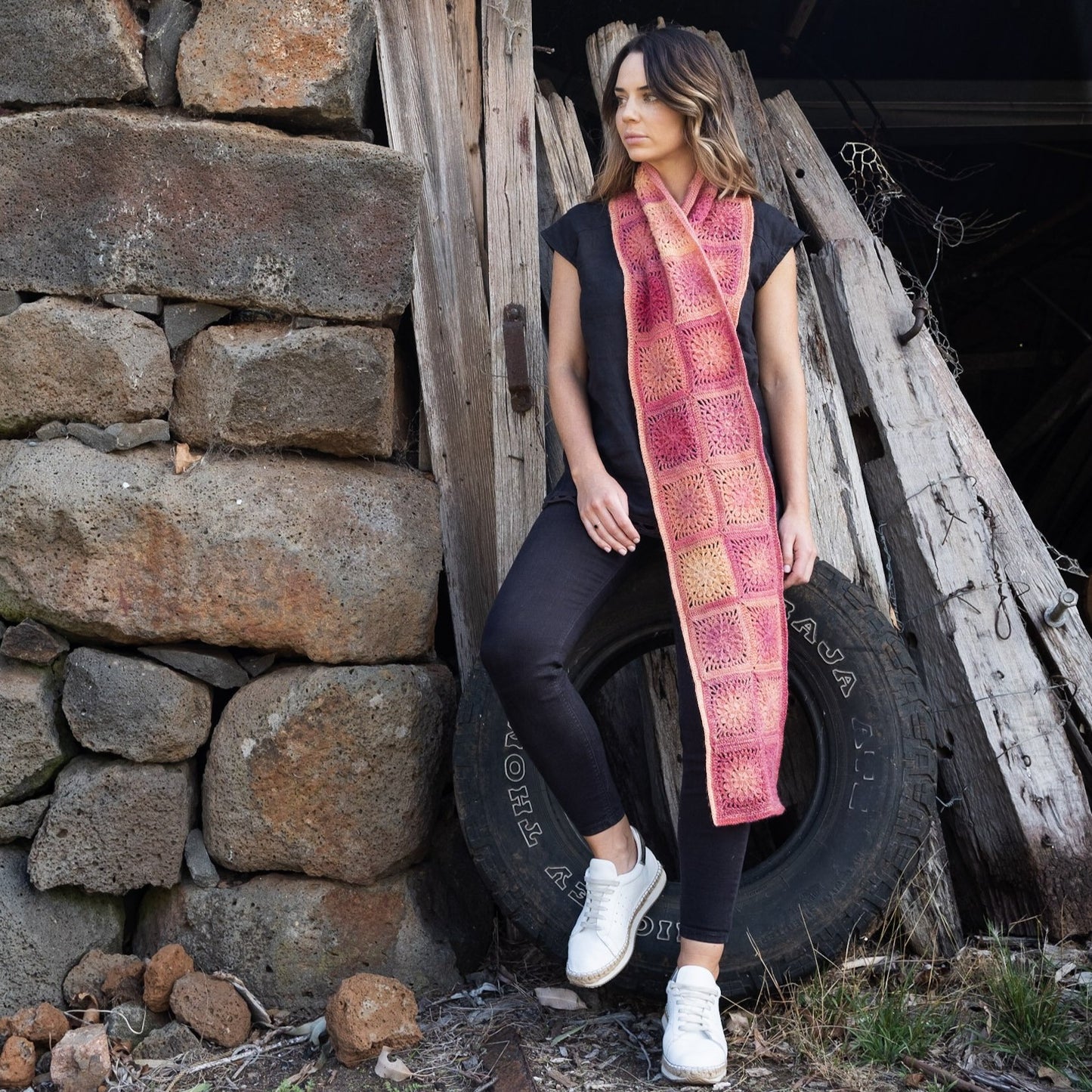 Woman wearing scarf design from Granny Square Flair by Shelley Husband