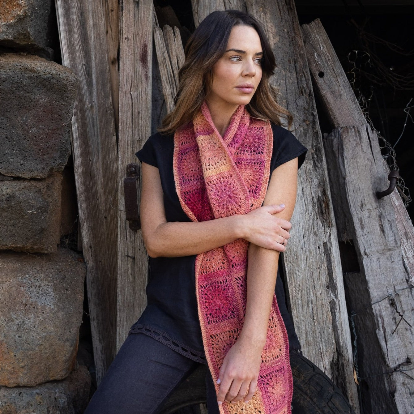 Woman wearing scarf design from Granny Square Flair by Shelley Husband