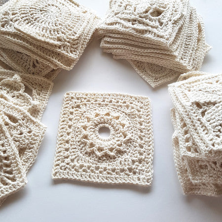 Stacks of cream granny squares from Granny Square Flair by Shelley Husband