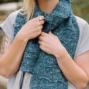 Close up of a woman wearing a Hillocks scarf by Shelley Husband