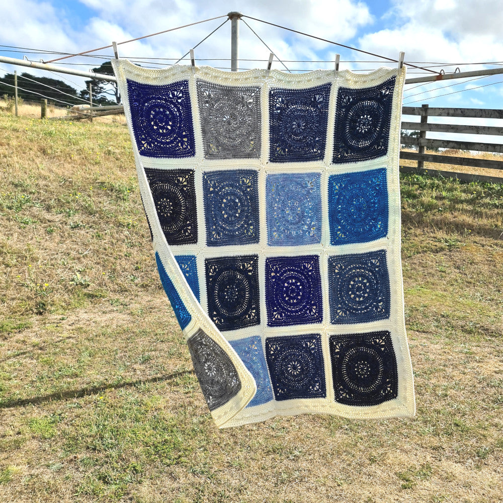 Oceanic blanket hanging on clothes line