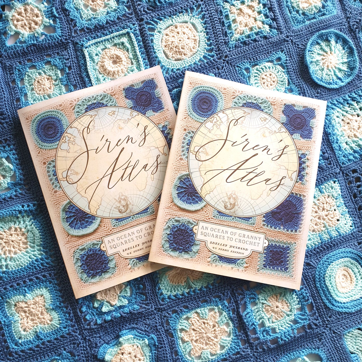 Siren's Atlas books by Shelley Husband on a Siren's Atlas sampler blanket