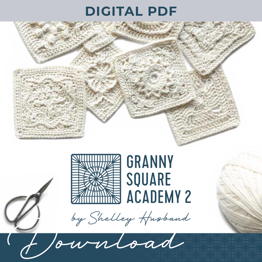 Granny Square Academy 2 front cover logo, sitting below 8 crocheted granny squares scattered over a white background. Black yarn scissors are in the bottom left corner and a ball of parchment coloured yarn sits in the bottom right. Words over the image say Digital PDF and Download.