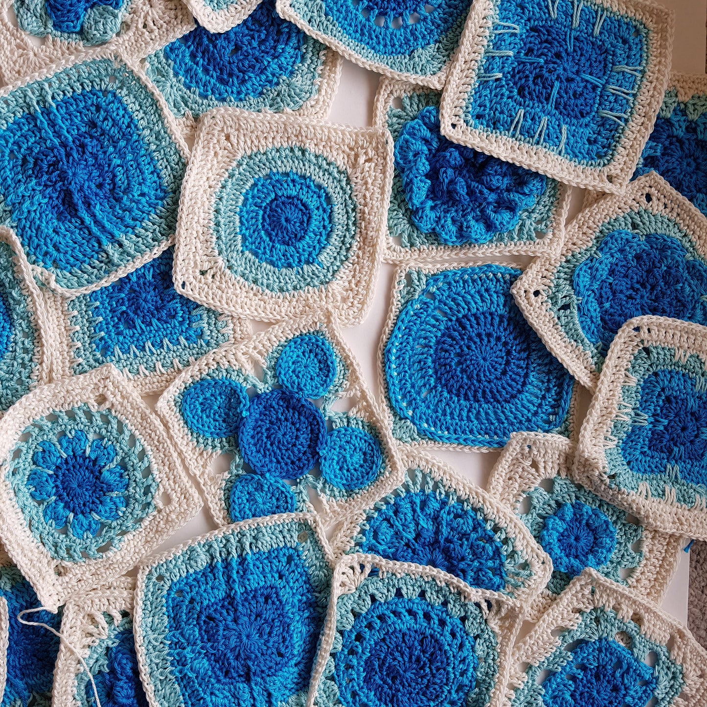 Granny squares in blues and cream from Granny Square Flair by Shelley Husband