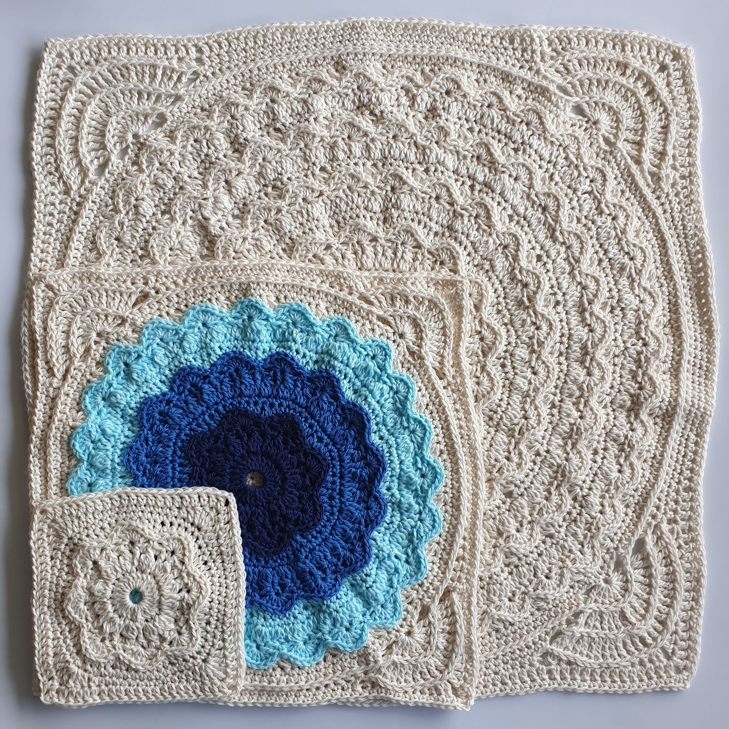 Three Granny squares in different sizes from Manderley Crochet Blanket by Shelley Husband sitting over one another