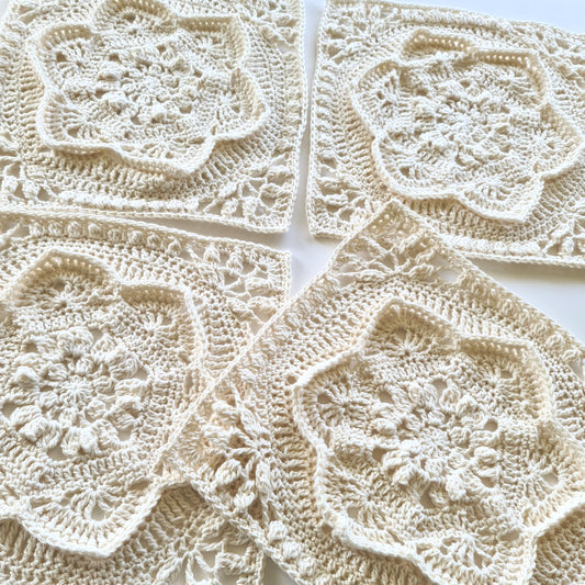 four cream floral Asterales granny squares - not joined 