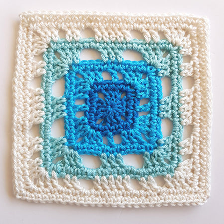 Banda pattern in four colours, cream, pale blue, bright blue and mid blue by Shelley Husband