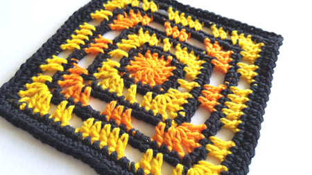 Close up of Banda pattern in three colours, black, yellow and orange by Shelley Husband