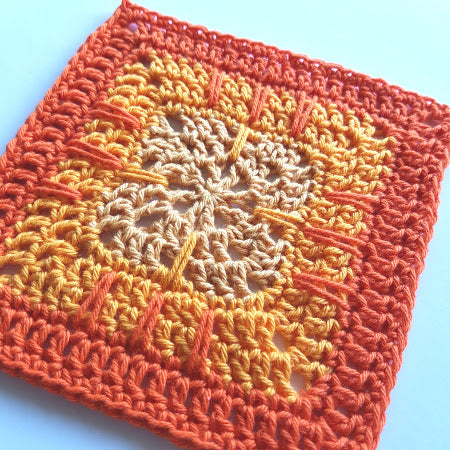 Close up of Bismarck pattern in three colours, red, orange and pale peach by Shelley Husband