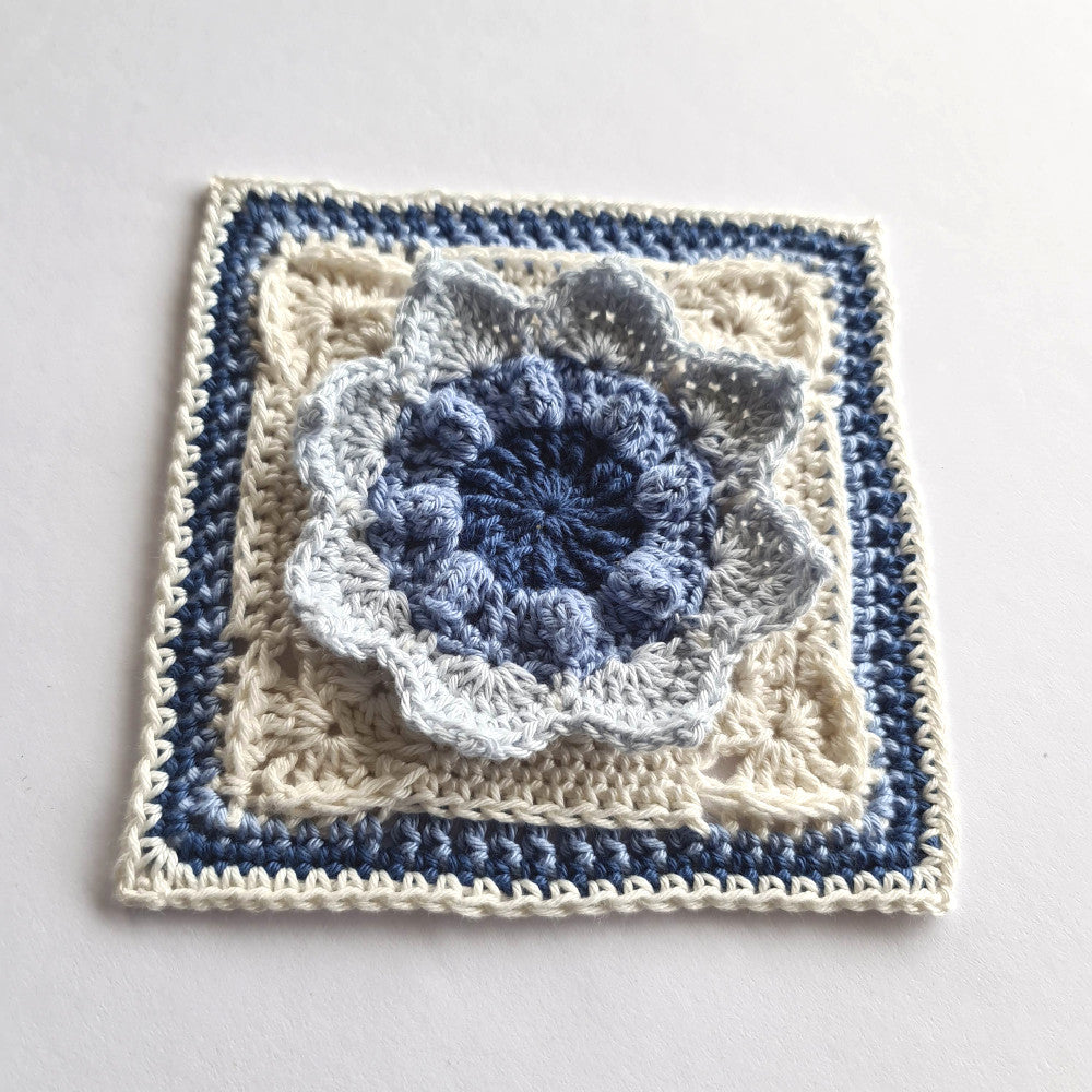 Charlene granny square crochet pattern by Shelley Husband in blues and cream