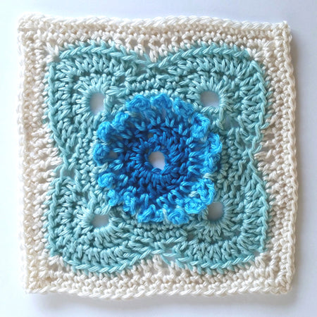 Flores in four colours, cream, pale blue, bright blue and mid blue by Shelley Husband