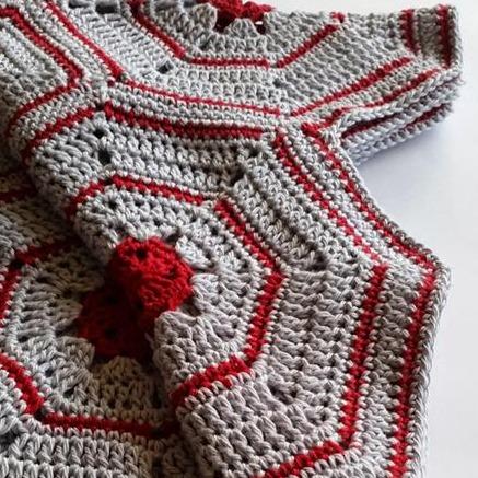 Close up of Galapagos Blanket Pattern by Shelley Husband in red and grey