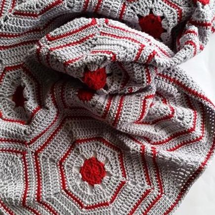 Galapagos Blanket Pattern by Shelley Husband rumpled in red and grey