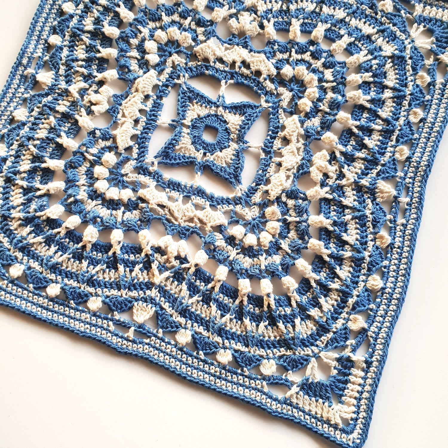 Giantess Blanket Pattern by Shelley Husband granny square in blue and cream