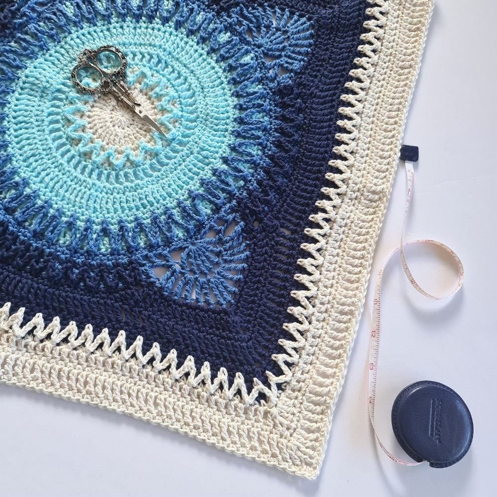 Hope large granny square in blues and cream with a retractable tape measure by Shelley Husband