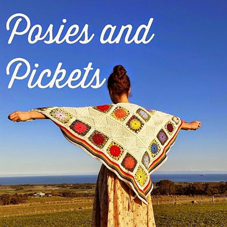 Posies and Pickets Blanket by Shelley Husband wrapped around a woman