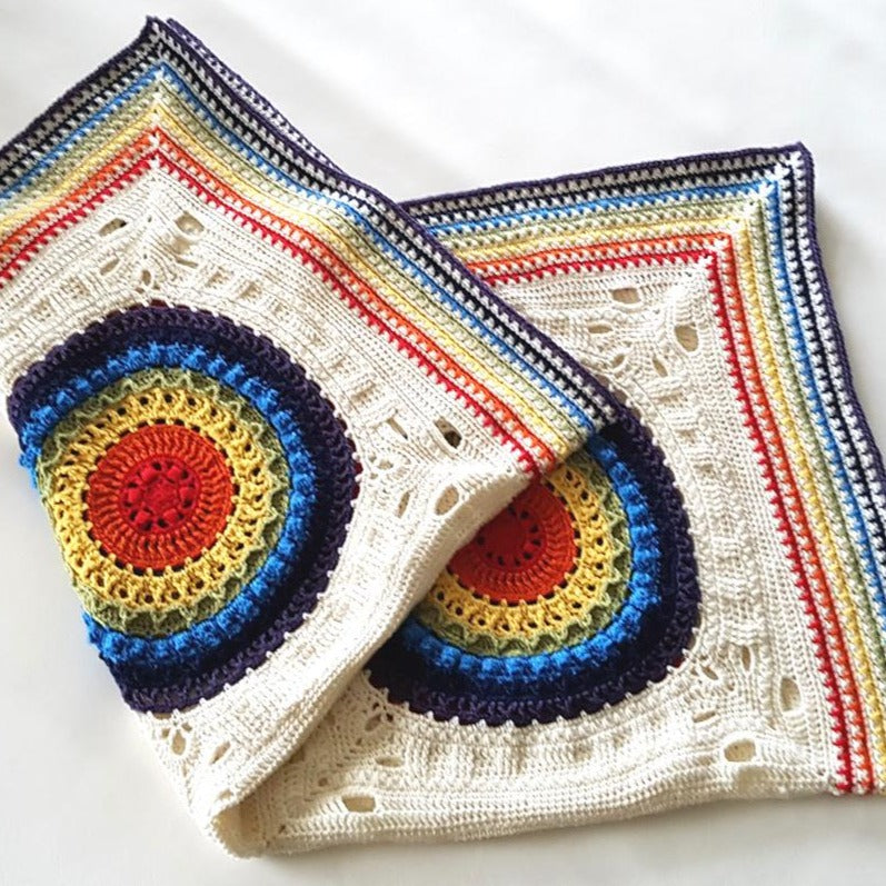 Folded colourful Kaboom Crochet Blanket Pattern by Shelley Husband