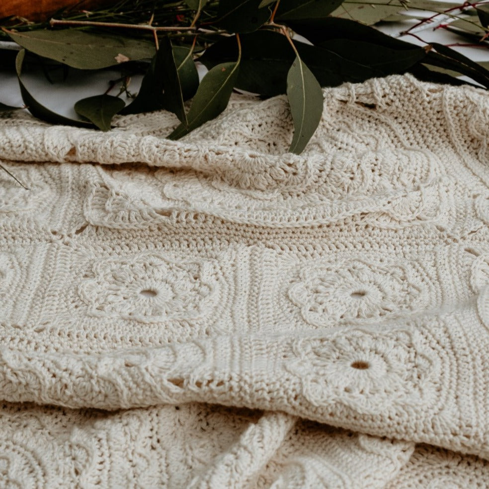 Manderley Crochet Blanket with native leaves behind it by Shelley Husband