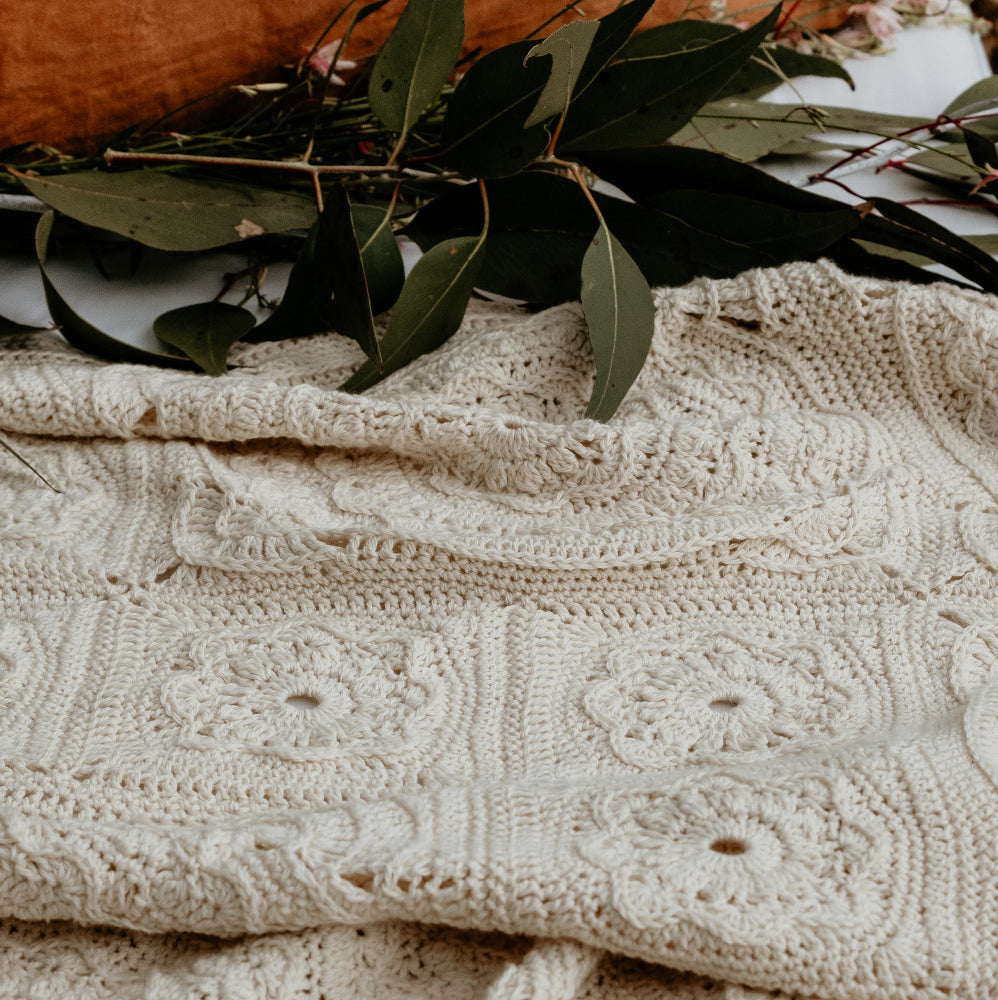 Manderley Crochet Blanket with native leaves behind it by Shelley Husband