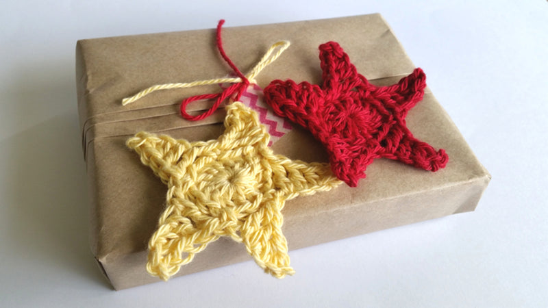 Hanging Stars on a brown paper wrapped gift by Shelley Husband