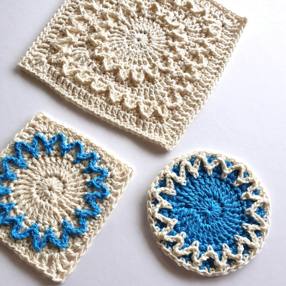 Shine with Hope Granny Squares in different sizes and one unfinished by Shelley Husband
