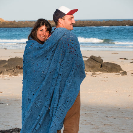 Couple wearing a blanket from Siren's Atlas by Shelley Husband