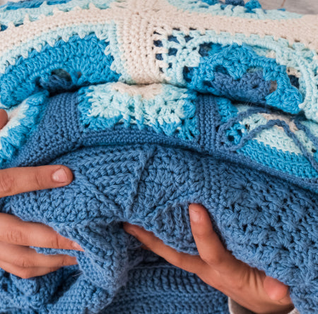 Stack of blankets from Siren's Atlas by Shelley Husband