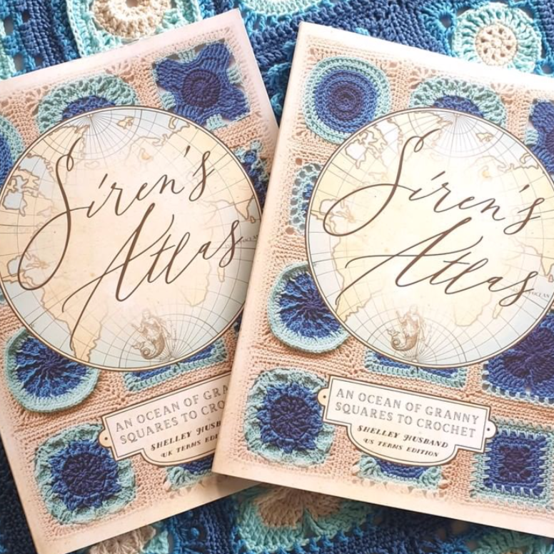 Close up of Siren's Atlas books by Shelley Husband