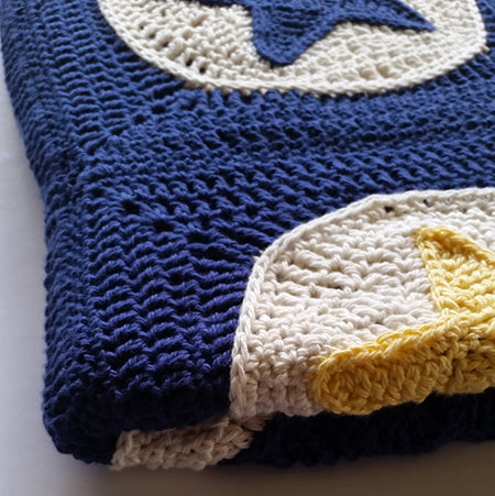 Close up of folded Star Light Star Bright Blanket Pattern by Shelley Husband