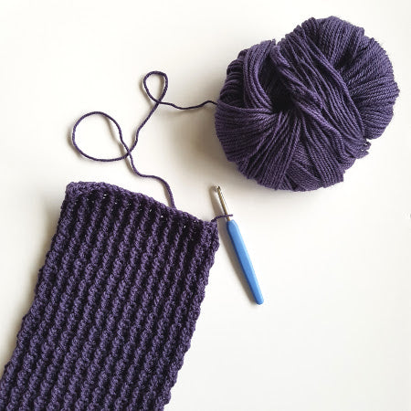 Winter Warmth Scarf by Shelley Husband in progress with a blue crochet hook