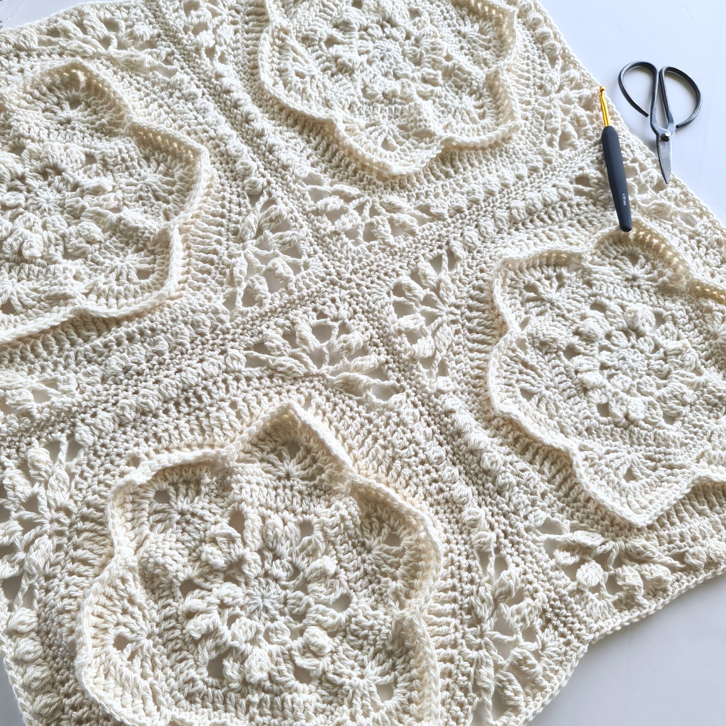 4 cream floral granny squares joined with scissors and crochet hook Asterales Crochet Granny Square Pattern by Shelley Husband