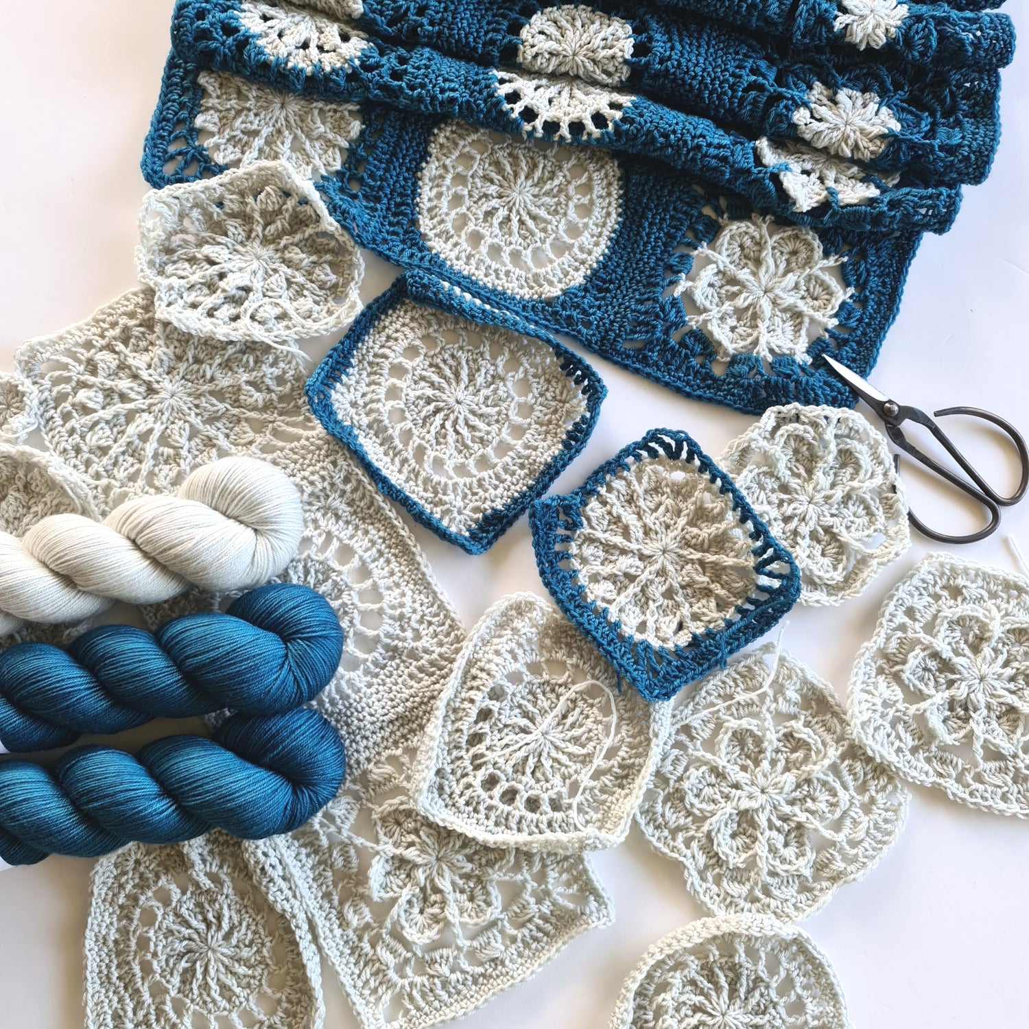 Work in progress of all white and blue and white versions of Frosty Flair Scarf Project by Shelley Husband