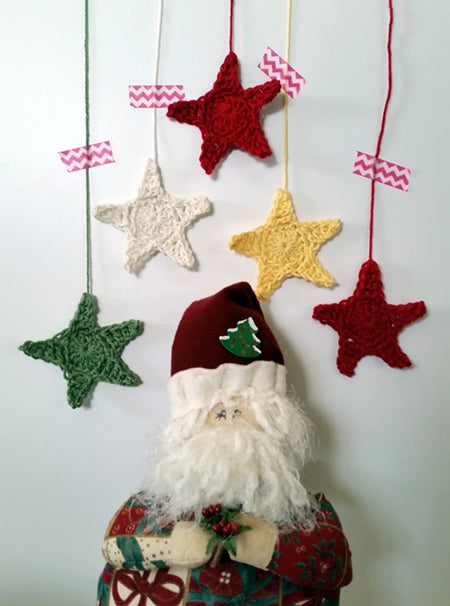 Hanging Stars with a handmade santa below by Shelley Husband