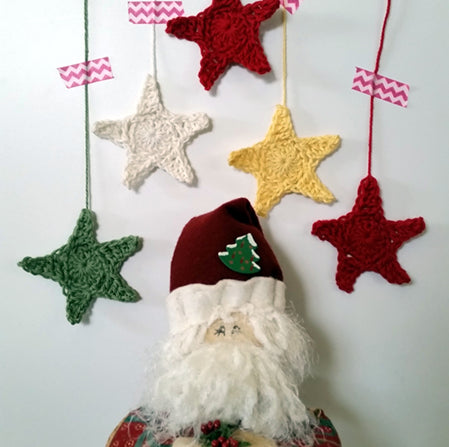 Hanging Stars with a handmade santa below by Shelley Husband