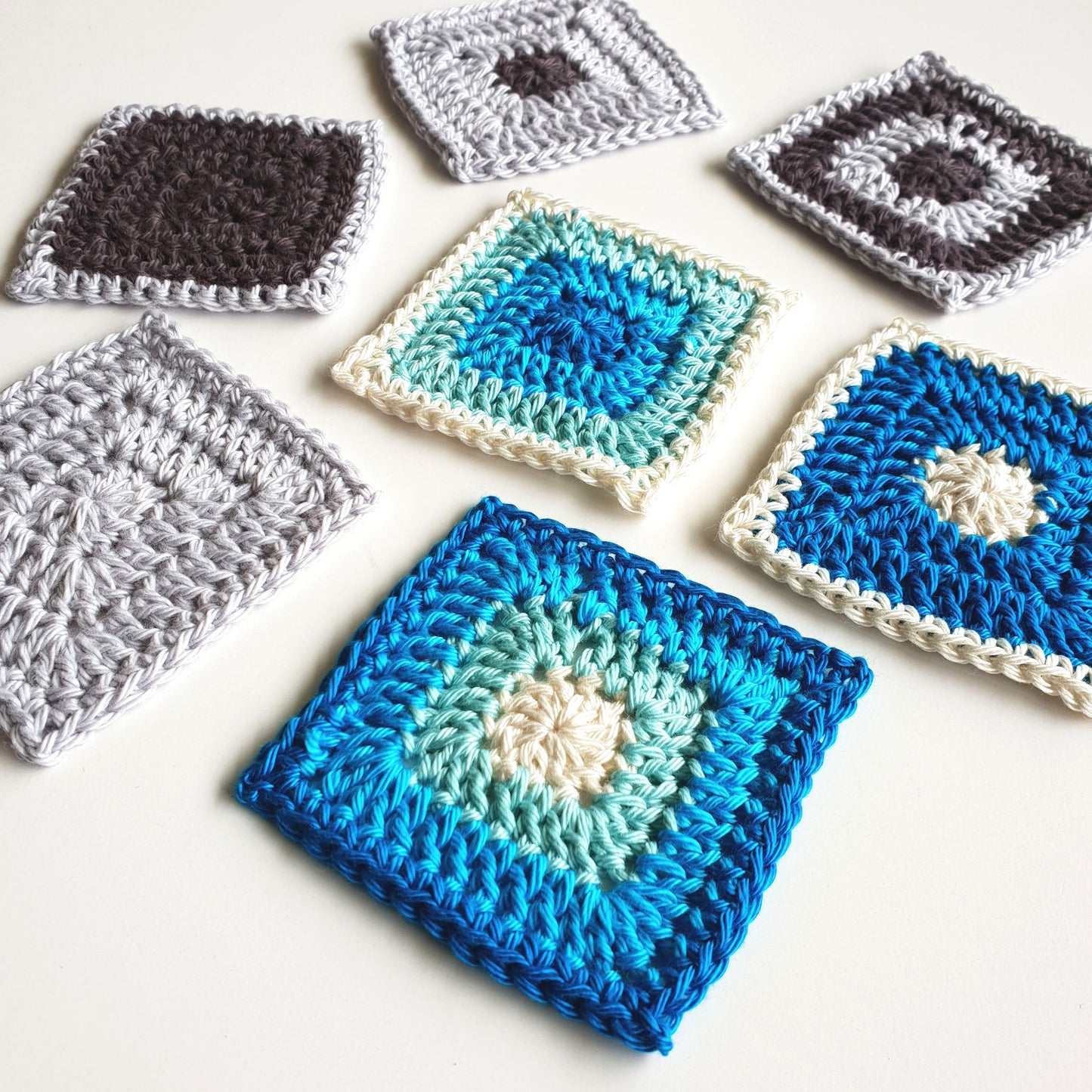Seven Scraptastic Square Pattern granny squares by Shelley Husband