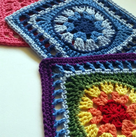 Three colourful Sharing is Caring Granny Square Pattern by Shelley Husband
